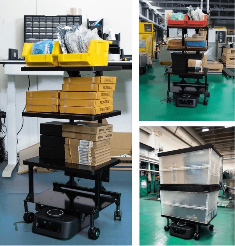 Photo of a Kachaka robot carrying a multi-tier rack stacked with parts bins and totes, standing by on the floor